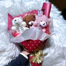 “Cuddly Sweetness: Teddy Bear and Snickers Combo”